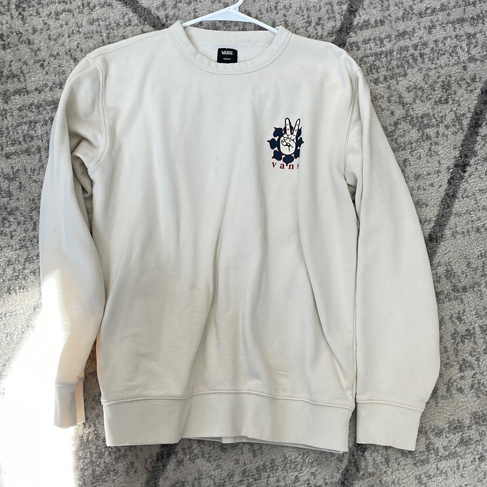 It’s a van sweater, cream color a little oversized